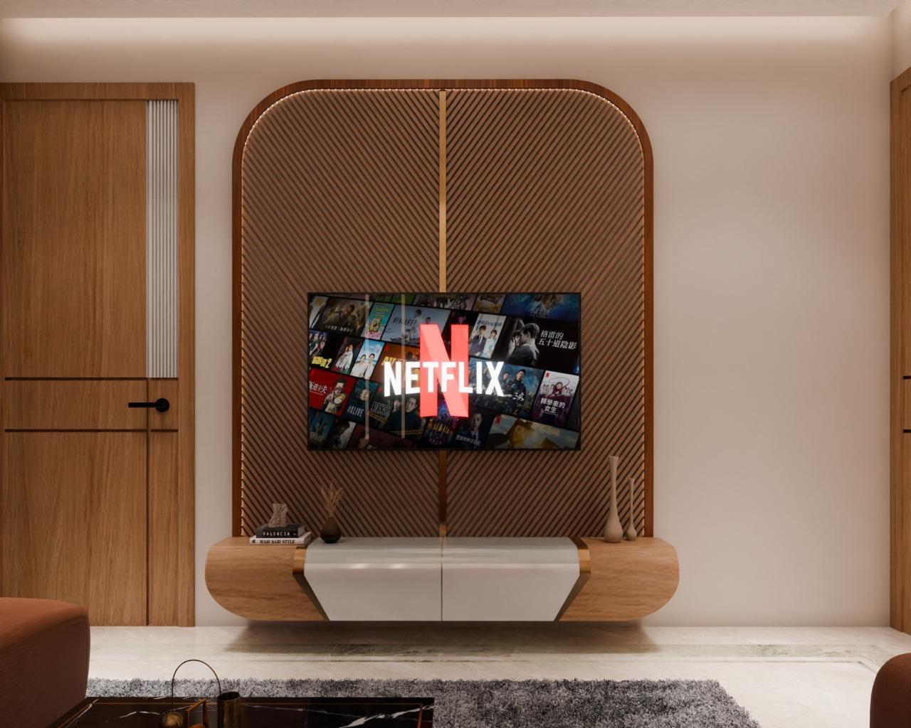 Floating wood-and-white TV console against a fluted wood panel wall